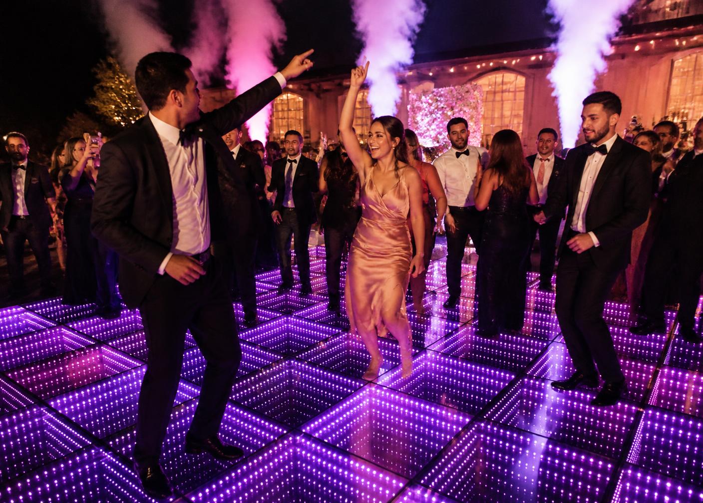 Guests dancing on the illuminated 3D infinity dance floor