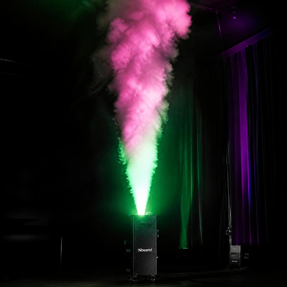 Vertical smoke machine firing an illuminated smoke plume